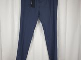 a pair of blue pants hanging on a white curtain
