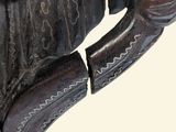 a statue of a horse with a glove on it ' s back