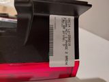 a label on the back of a red cell phone