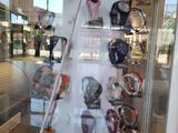 a display of watches and skis on display in a glass case