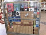 a large cage with many items in it in a warehouse