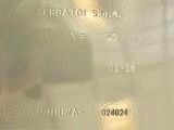 a close up of a silver plate with a picture on it