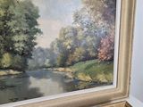 a picture of a painting of a river in a frame