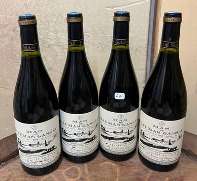 three bottles of wine are lined up on a wooden tray