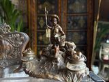 a statue of a man riding a horse on a table