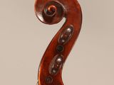an antique violin with a scroll and a bow on a white background