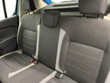 the back seats of a car are grey and black