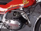 a red motorcycle parked on the side of the road
