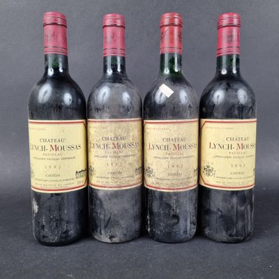 three bottles of red wine sitting next to each other on a table