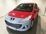 a small red and blue car parked in a garage