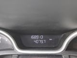 the dashboard of a car with a digital clock on it