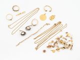 a collection of gold jewellery including rings, bracelets, rings and necklaces
