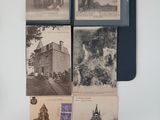 several old photographs of people and buildings are hanging on a wall