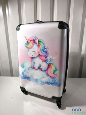 a suitcase with a picture of a unicorn sitting on a cloud