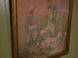 a picture of a painting hanging on the wall of a bathroom