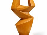 an image of a wooden sculpture on a wooden base