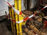 a yellow pole with a red and white tape around it