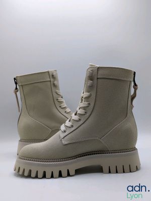 the boots are made of sued and have a rubber sole