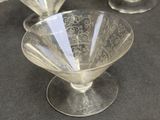three glasses that are sitting on a table