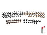 a group of small black and brown metal objects sitting on top of a white surface