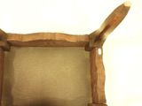 a chair made out of a piece of wood with a seat made out of a piece of wood