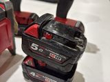 two tools that are sitting on a table