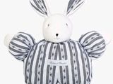 a stuffed animal that is sitting on a white surface