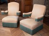 two chairs that are sitting on a parquet floor