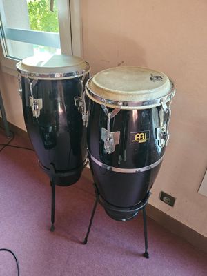 two congas sitting next to each other in a room