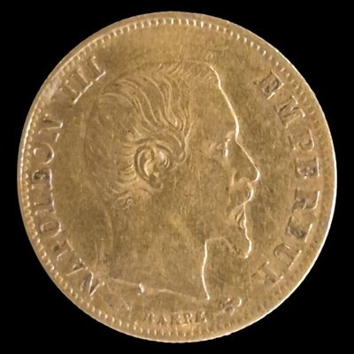 l'image d'une pièce d'or sur laquelle figure le visage d'une femme