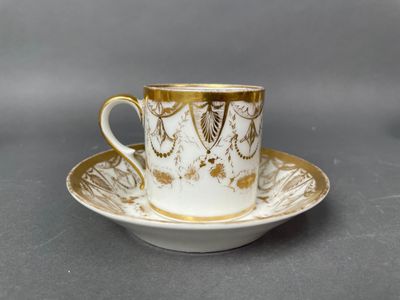 an image of a cup and saucer on a saucer on a table