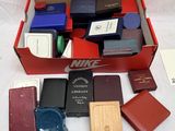 a box of assorted electronic devices on a table