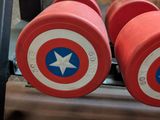 two red dumbs with a captain shield on them