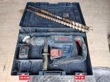 a tool in a toolbox on a wooden floor