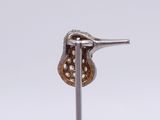 a small metal object with a bird on top of it