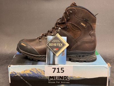 a box with a pair of hiking boots on top of it
