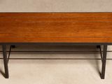 a wooden coffee table with metal legs and a wooden top