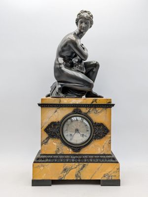 an image of a statue of a woman sitting on top of a clock