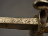 a close up of a metal object with a metal handle