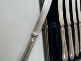 silverware in a case with a knife and a knife on it