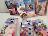 several pairs of frozen princess socks are sitting on a table