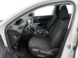 the interior of a white car with black seats and a steering wheel