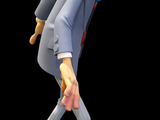 a figurine of a man in a suit and bow tie