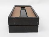 an image of a wooden box with a handle on it
