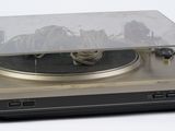 a turntable with a clear cover on top of it