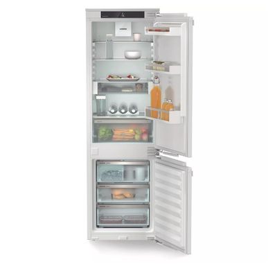 an image of a white refrigerator with its door open on a white background