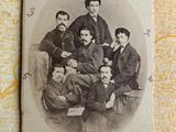 an old photo of a group of men posing for a picture