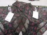 a pair of underwear with tags on them on a bed