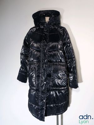 the coat is shiny and shiny and has a hood on it