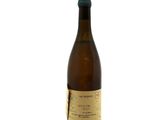 the bottle of wine is empty on a white surface